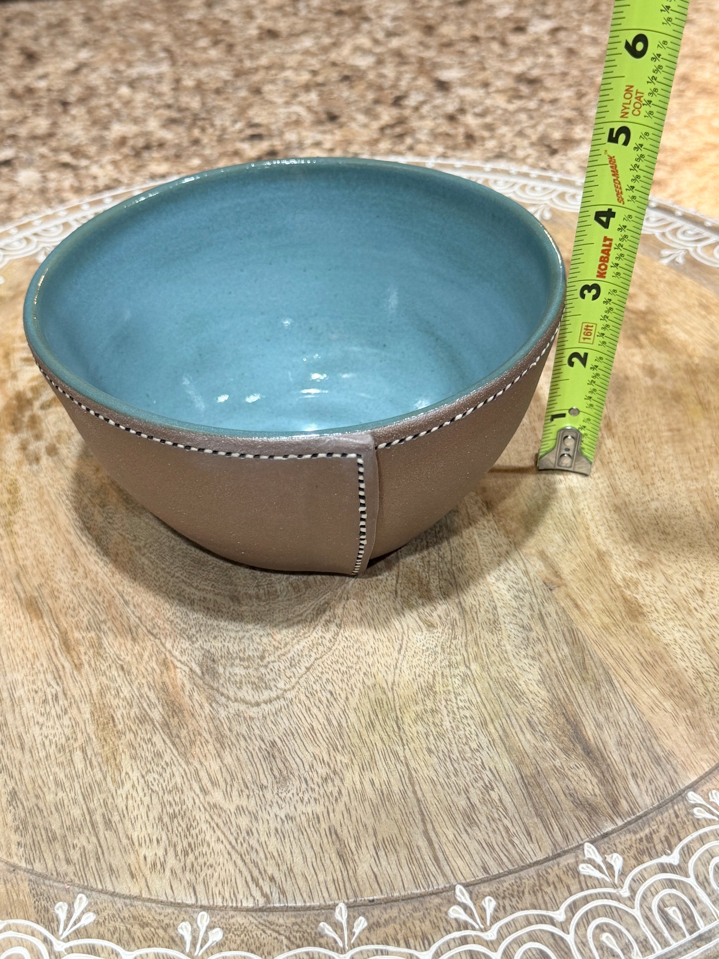 Stitched leather and teal bowl
