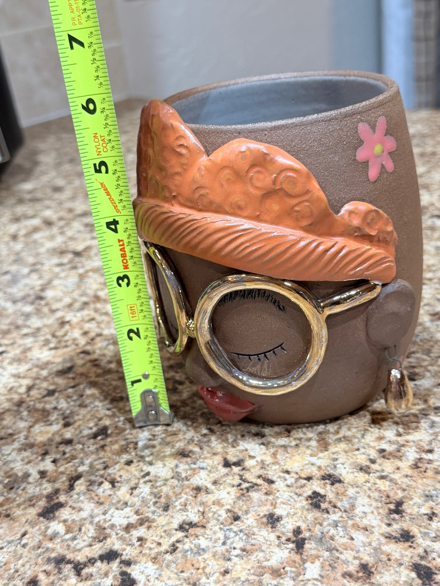 Gold glasses face vase