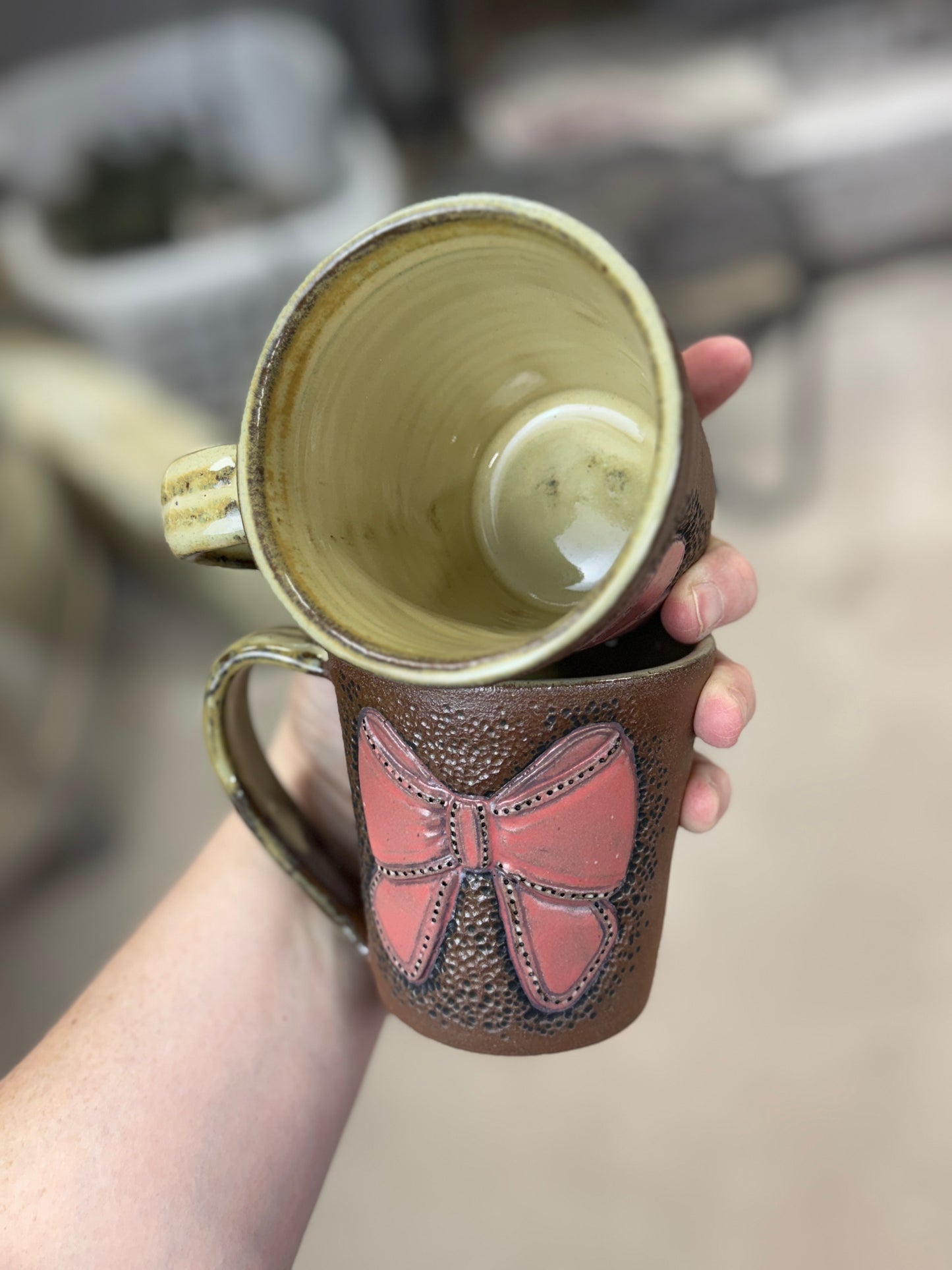 Tooled leather bow mugs