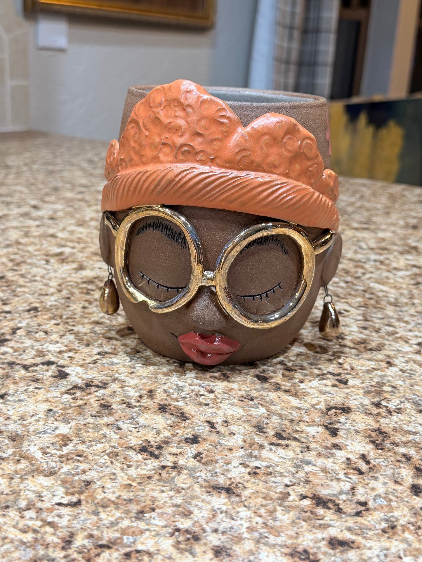 Gold glasses face vase