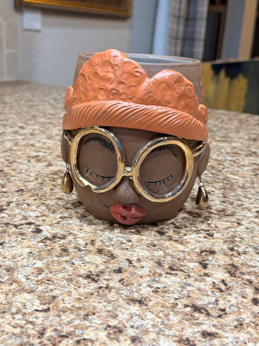 Gold glasses face vase