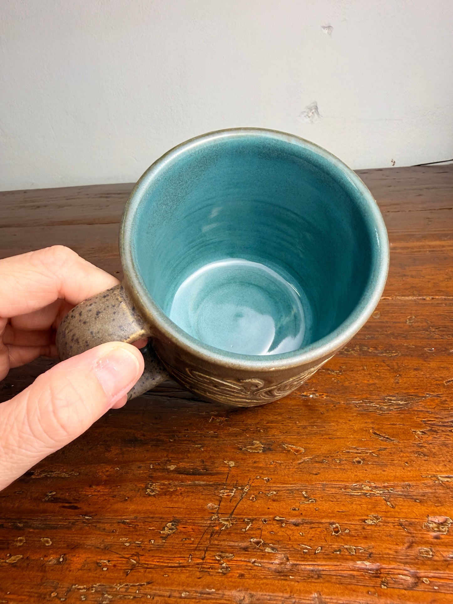 Tooled leather flower mug