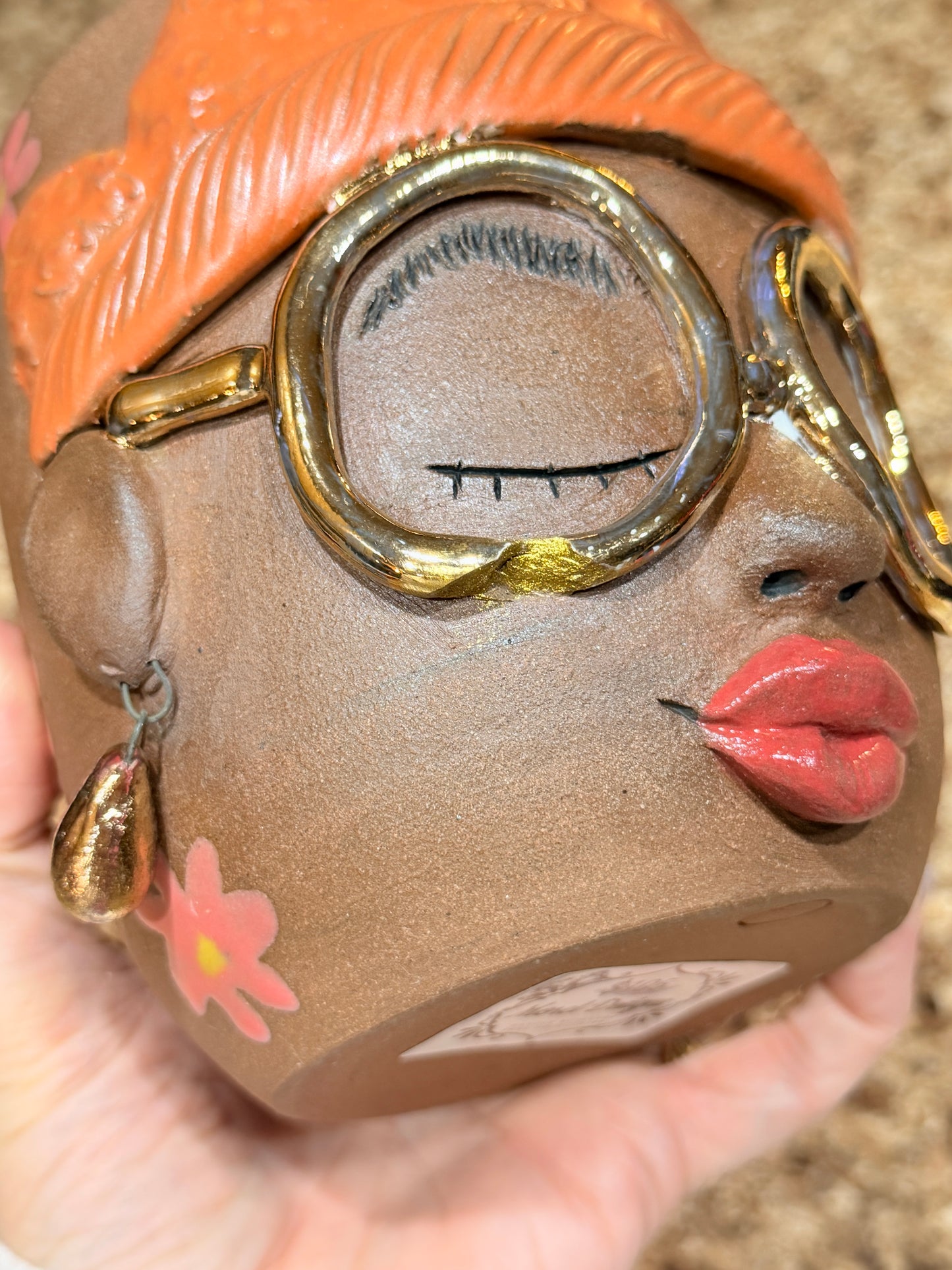 Gold glasses face vase