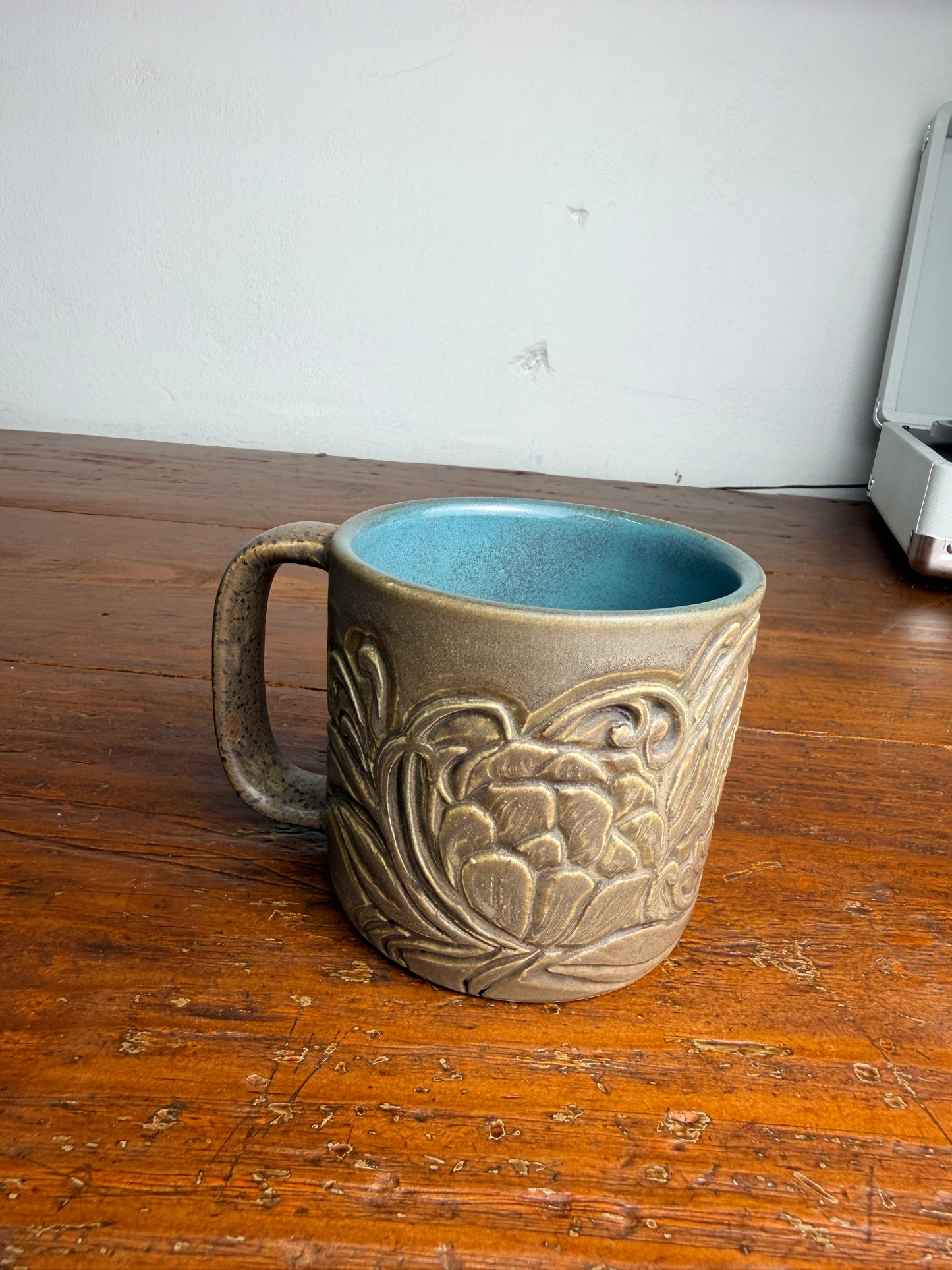 Tooled leather flower mug
